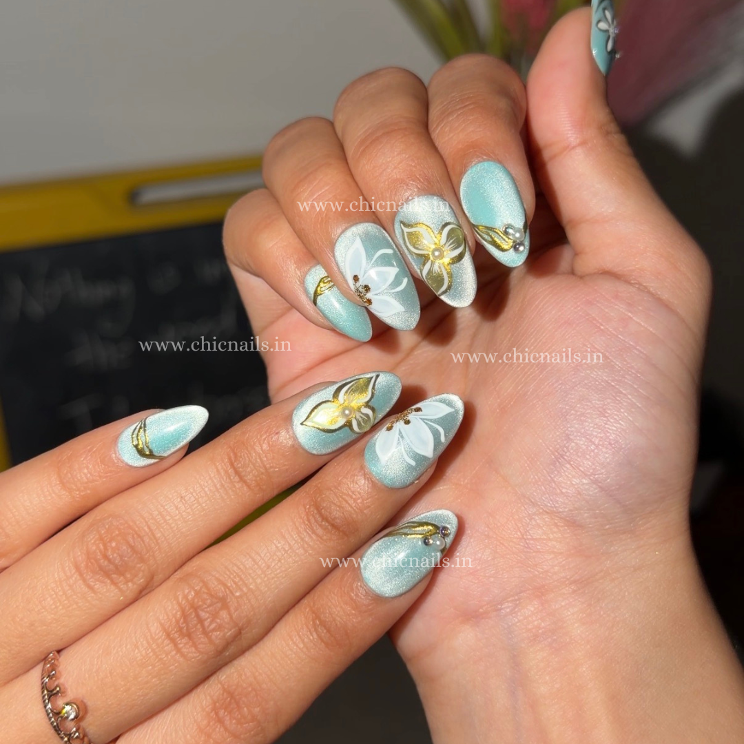Aquabloom cat eye chrome press on nails with floral nail art by Chic Nails India