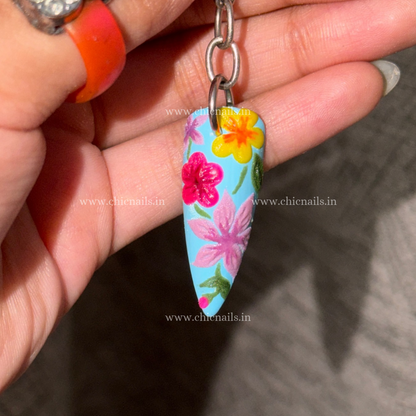 Bloomstitch floral nail keychain by ChicNails India, featuring blue base and colorful embroidered-style nail art