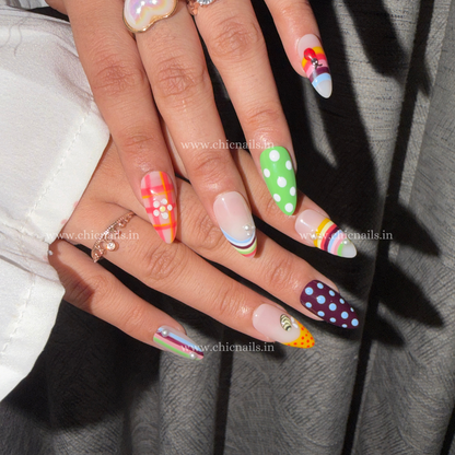 Colorful BuzzBloom summer press-on nails with ladybug, honeybee, polka dots, and bright floral-inspired design by Chic Nails India