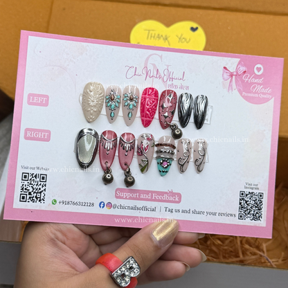 Garba Glam Navratri press-on nails featuring hanging accessories, chrome and cat-eye nail art by Chic Nails Official