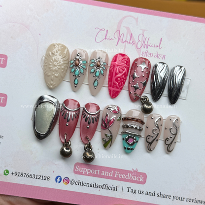 Garba Glam Navratri press-on nails featuring hanging accessories, chrome and cat-eye nail art by Chic Nails Official