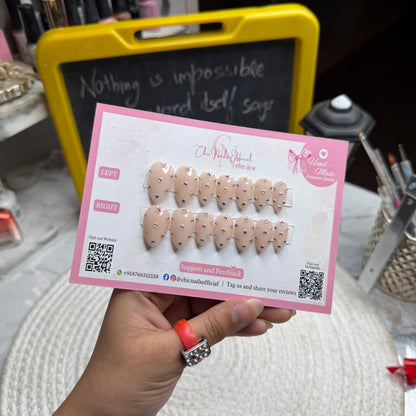Glamstone nude press on nails with rhinestone nail art and glossy finish by Chic Nails India