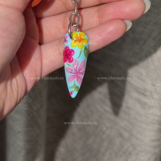 Bloomstitch floral nail keychain by ChicNails India, featuring blue base and colorful embroidered-style nail art