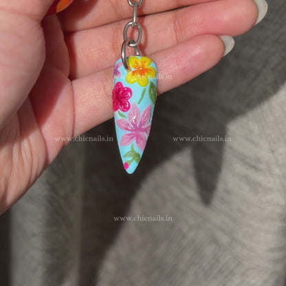 Bloomstitch floral nail keychain by ChicNails India, featuring blue base and colorful embroidered-style nail art