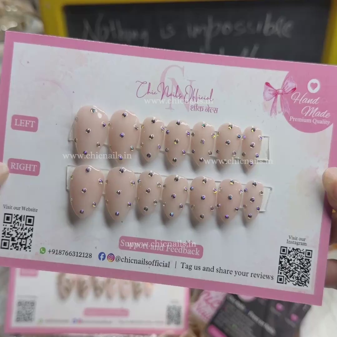Glamstone nude press on nails with rhinestone nail art and glossy finish by Chic Nails India