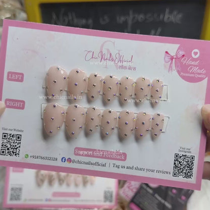 Glamstone nude press on nails with rhinestone nail art and glossy finish by Chic Nails India