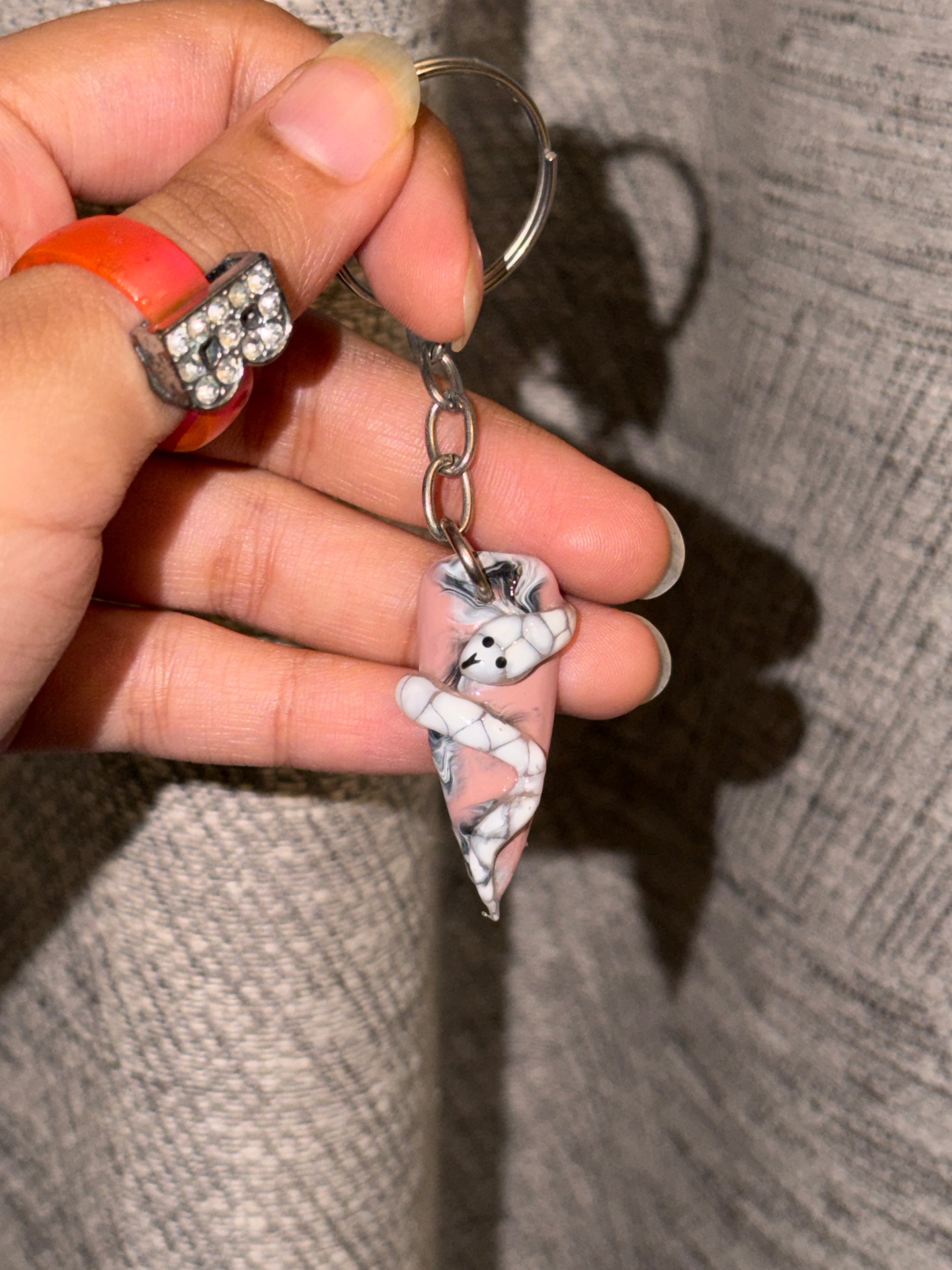 Snakey 3D snake nail keychain by ChicNails India with a white and pink nail-shaped base and detailed snake design