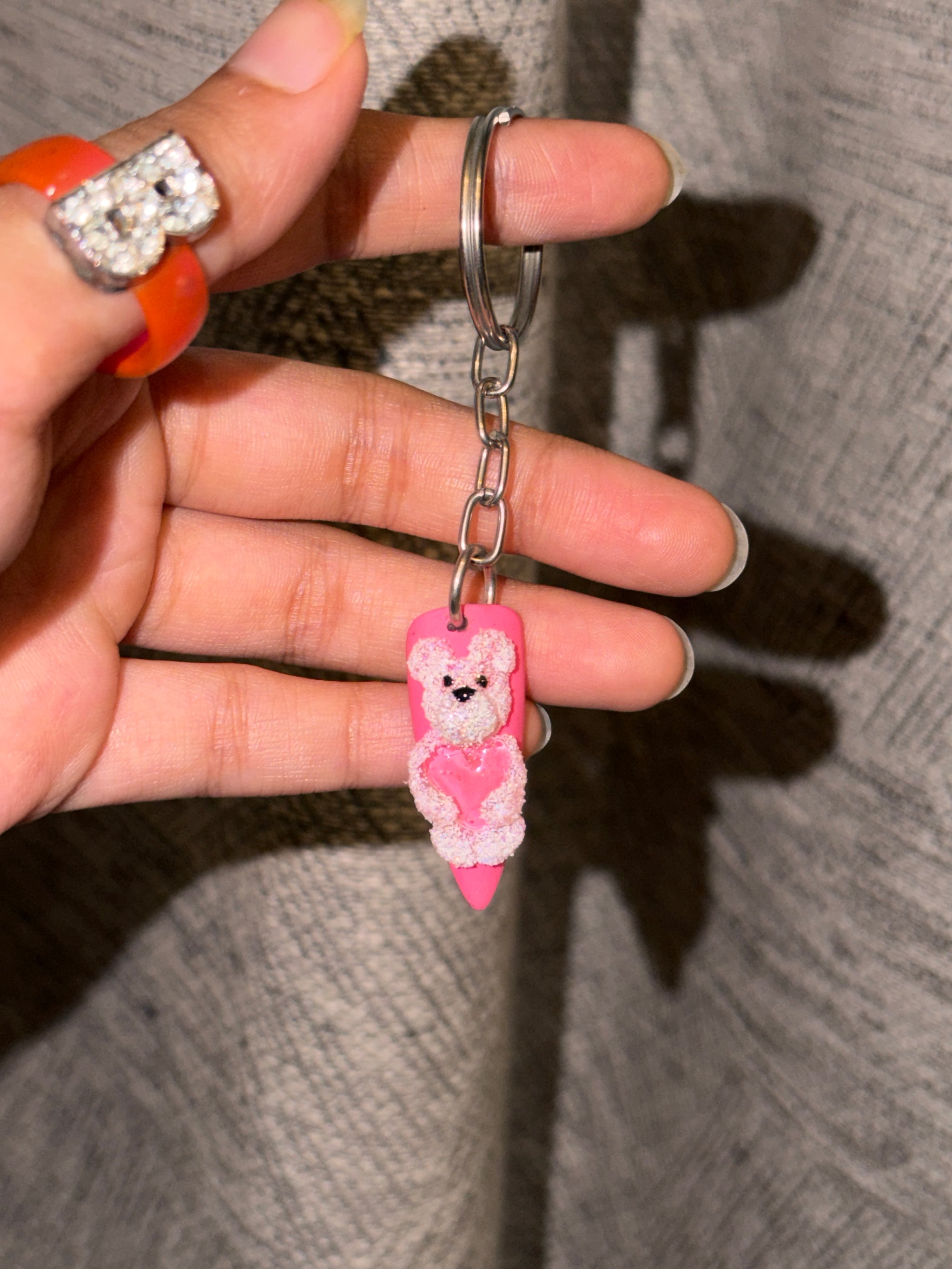Teddy 3D bear nail keychain by ChicNails India featuring a pink nail-shaped base with a cute teddy bear and heart design