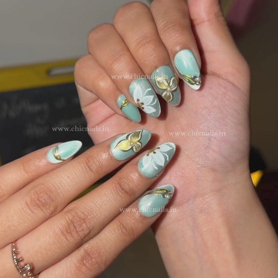 Aquabloom cat eye chrome press on nails with floral nail art by Chic Nails India