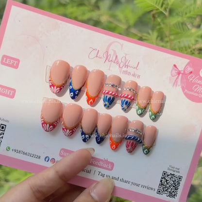 GarbaRang multicolor French Navratri press-on nails with festive Garba-inspired detailing by Chic Nails India.