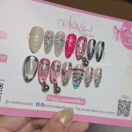 Garba Glam Navratri press-on nails featuring hanging accessories, chrome and cat-eye nail art by Chic Nails Official
