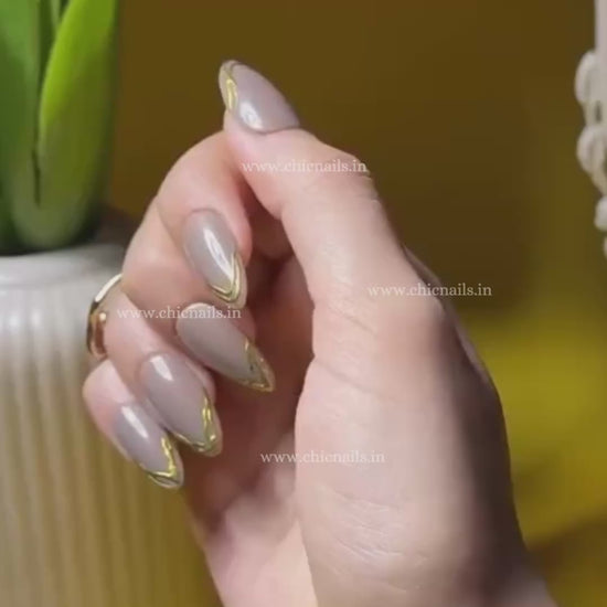 Lumé nude cat eye press on nails with chrome French tips nail art by Chic Nails India