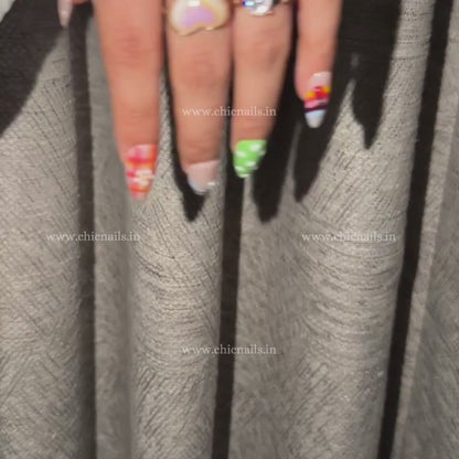 Colorful BuzzBloom summer press-on nails with ladybug, honeybee, polka dots, and bright floral-inspired design by Chic Nails India